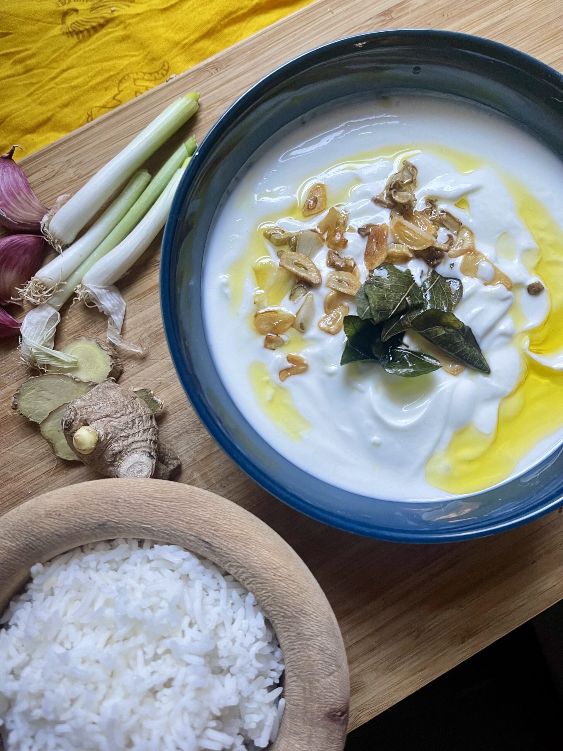 Close-up of a bowl filled with South Indian Yoghurt Curry, featuring a rich blend of three ingredients and aromatic curry leaves, creating a delicious and simple dish.