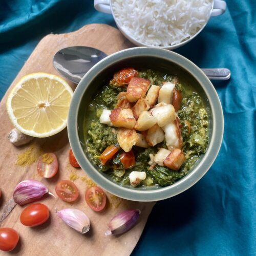 Close-up of Saag Halloumi with Kale, a comforting and flavorful dish inspired by the Indian classic Saag Paneer. The tangy and spicy flavors make it a cherished recipe, tempting enough to consider a midnight snack. A dreamy fusion of comfort and zest.