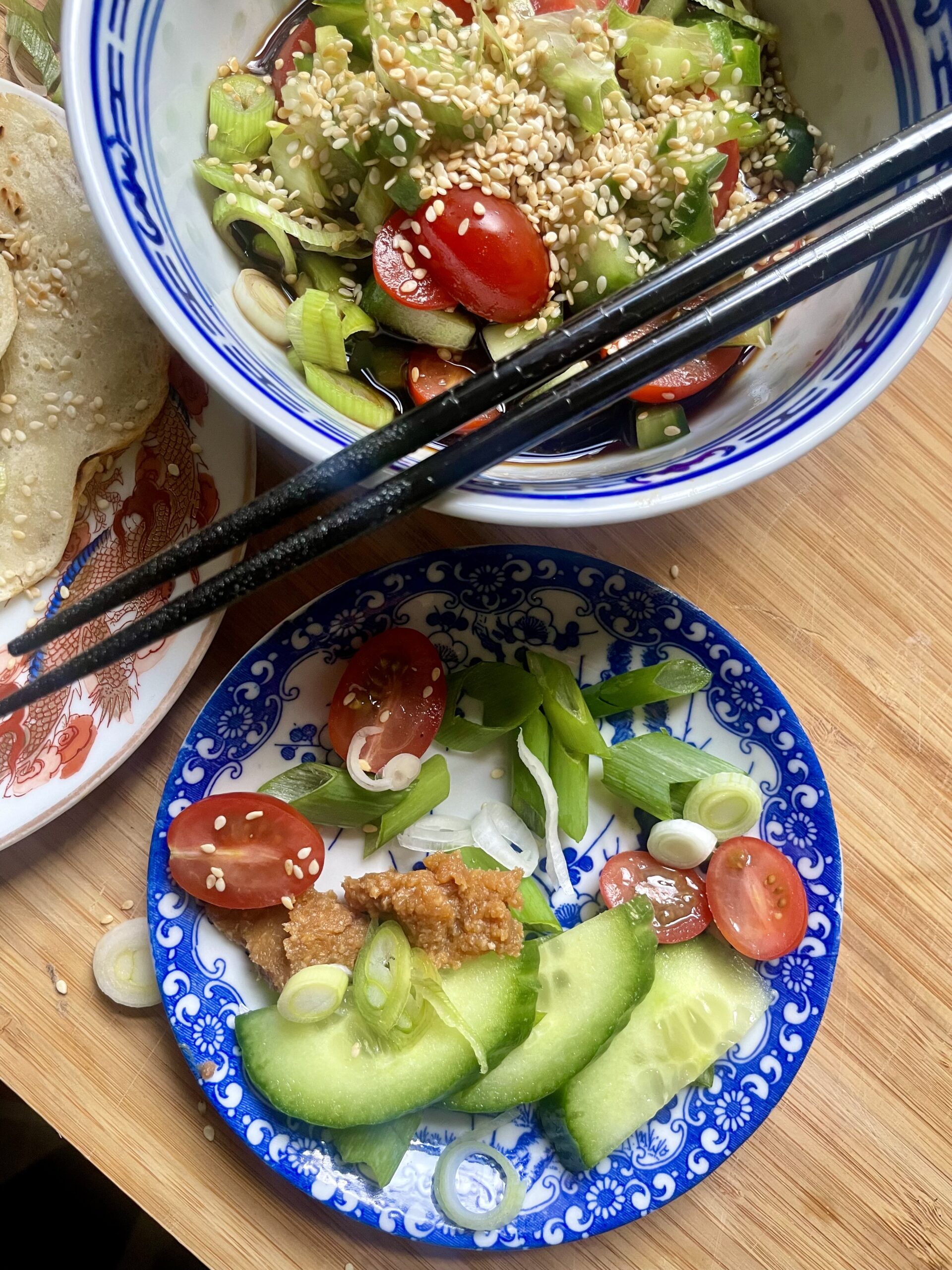 Close-up view of the fresh ingredients for the soy-miso-dipping sauce, including cucumbers, miso paste, and spring onions. A vibrant display of components contributing to the delicious and flavorful accompaniment for the savory sourdough discard pancakes.