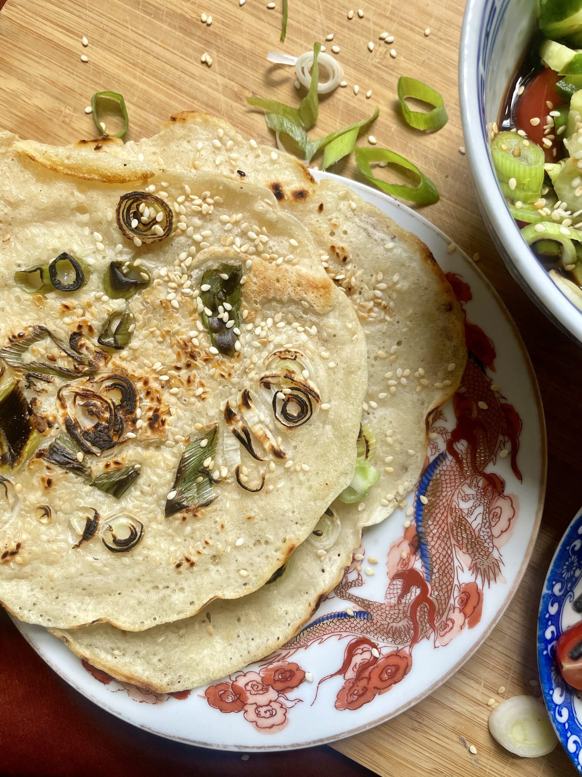 Close-up of a platter adorned with finished crispy sourdough discard pancakes, showcasing their golden-brown perfection. A tempting and satisfying lunchtime delight ready to be enjoyed.
