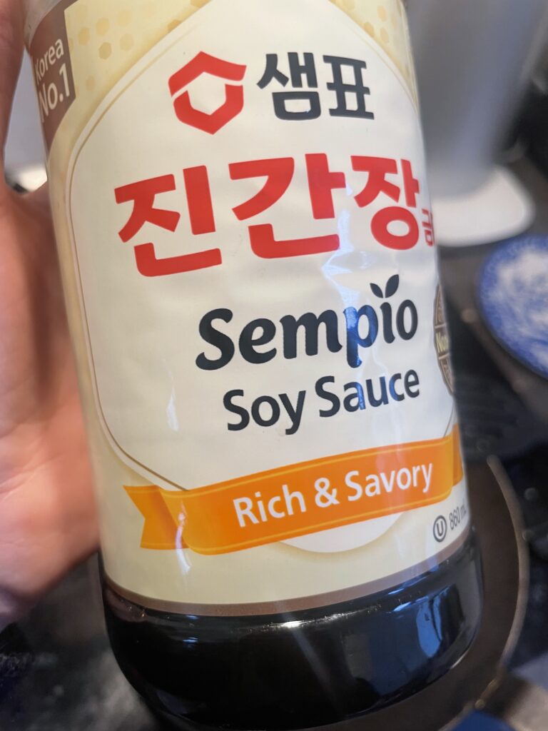 Close-up view of the soy sauce brand used in the savory sourdough discard pancake recipe. Highlighting the key ingredient that adds depth and flavor to the accompanying soy-miso-dipping sauce.