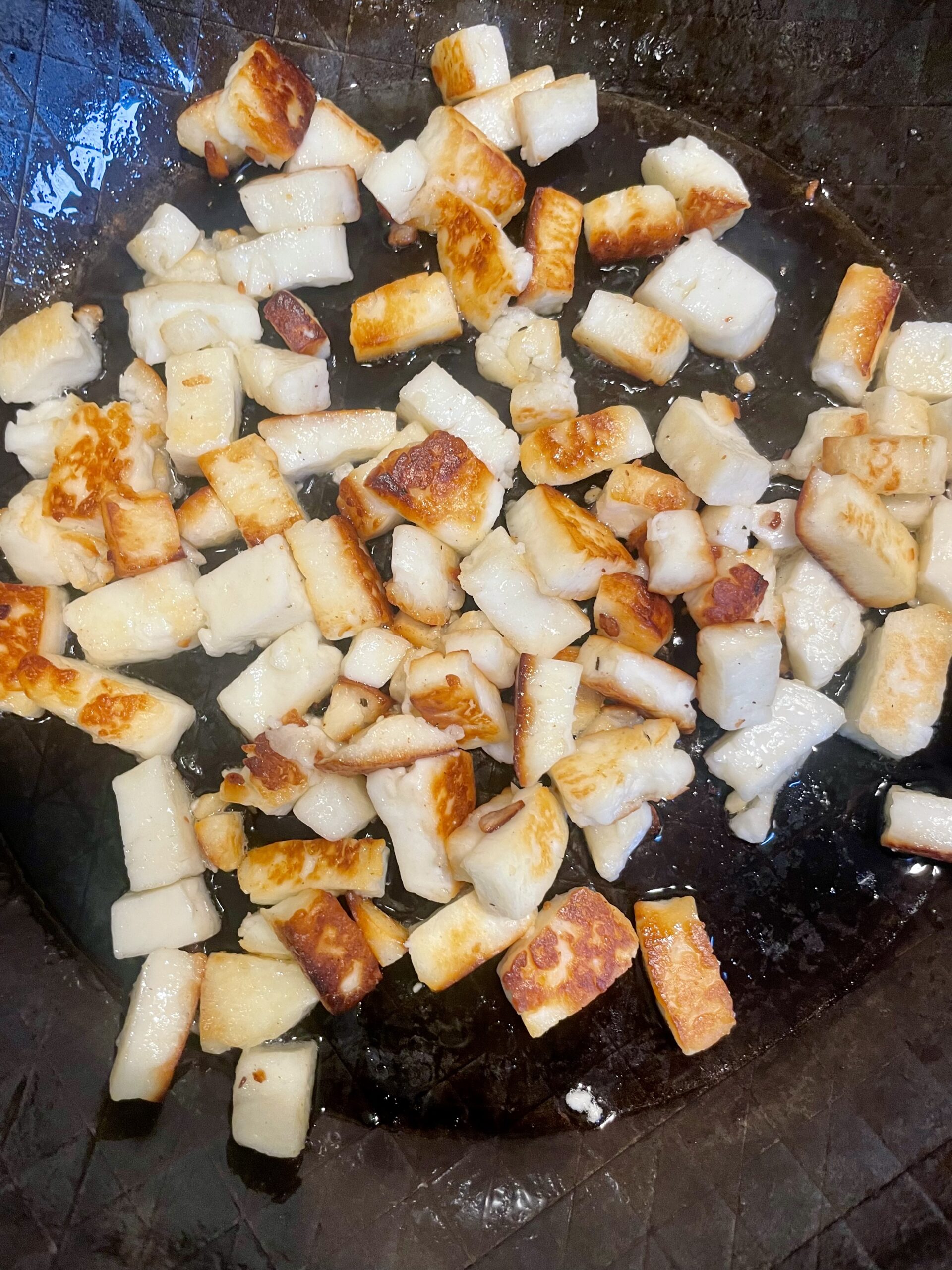 Step two of the Saag Halloumi Kale Recipe: Fry the Halloumi until golden. 