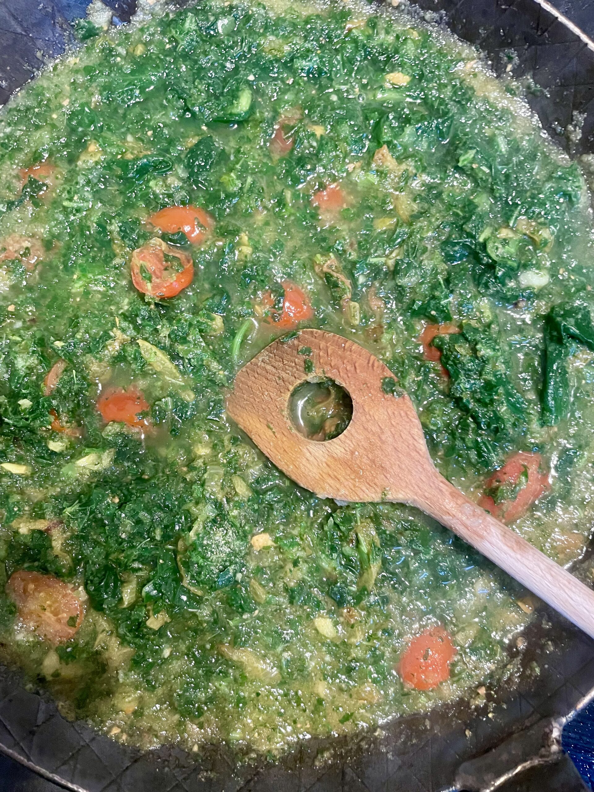 Saag Halloumi Kale - Step 8 Defrosted Kale, cherry tomatoes and the onion, garlic, ginger mixture combined 