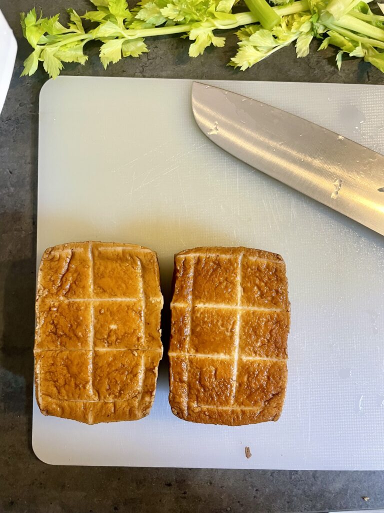 Tofu on the Cutting Board – Ready to Transform into Flavorful Cubes for Asian Delight