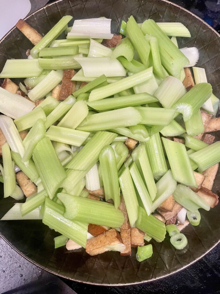 Sizzling Wok Harmony: Celery and Golden Tofu Infused with Aromatics